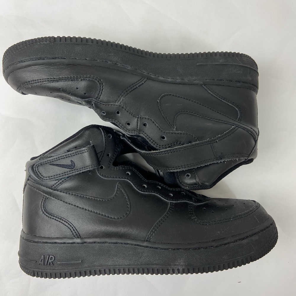 Black high top Nike Air Force Ones